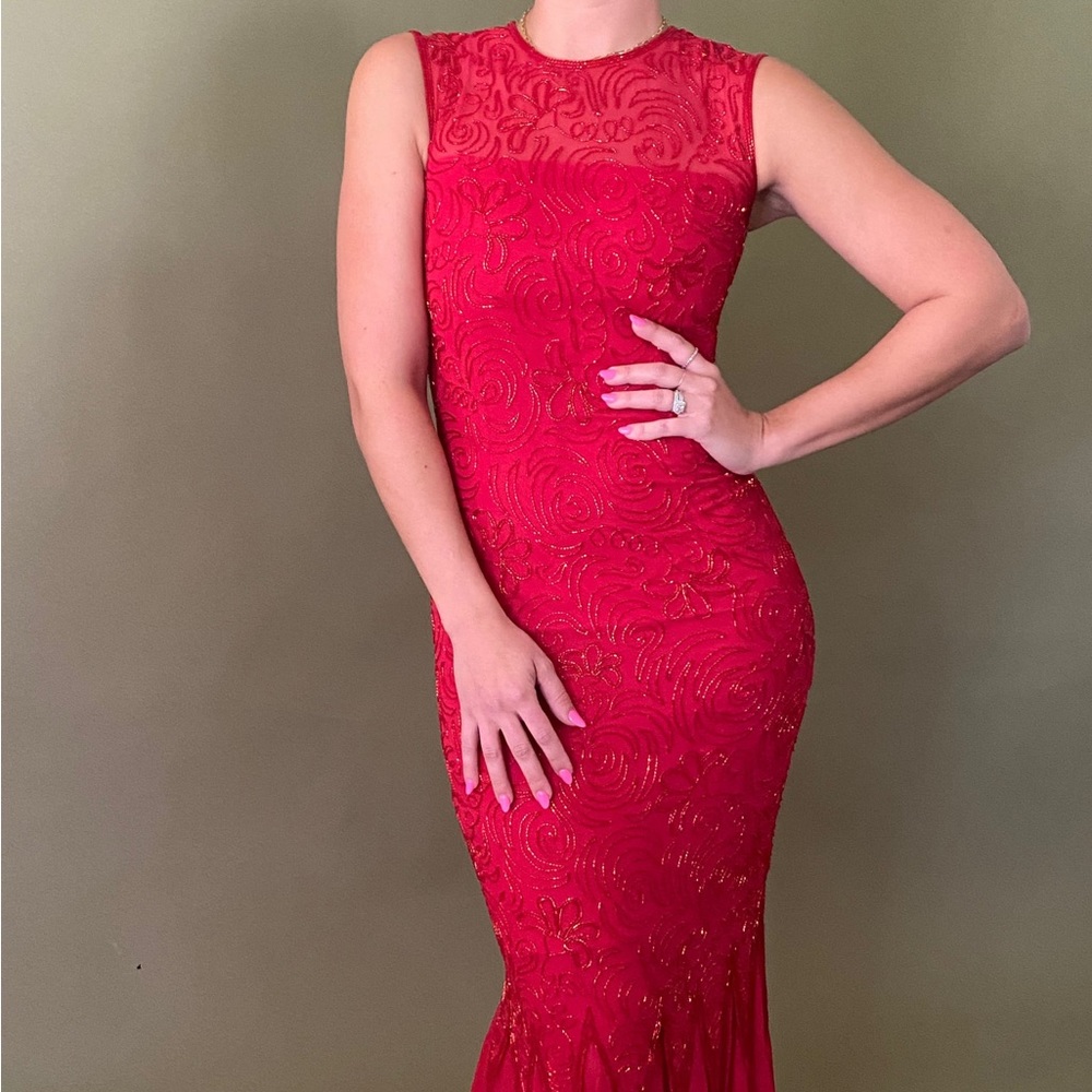 Vintage red beaded silk dress. Beaded embellishment and silk ruffle at base.